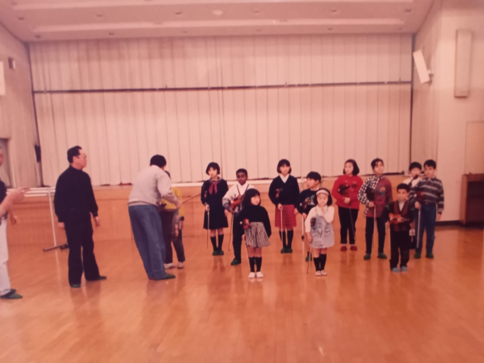 Egyptian and Japanese Suzuki violin students rehearsing before a concert in Tokyo with Kobayashi Sensei and Dr. Osman El Mahdy 1994